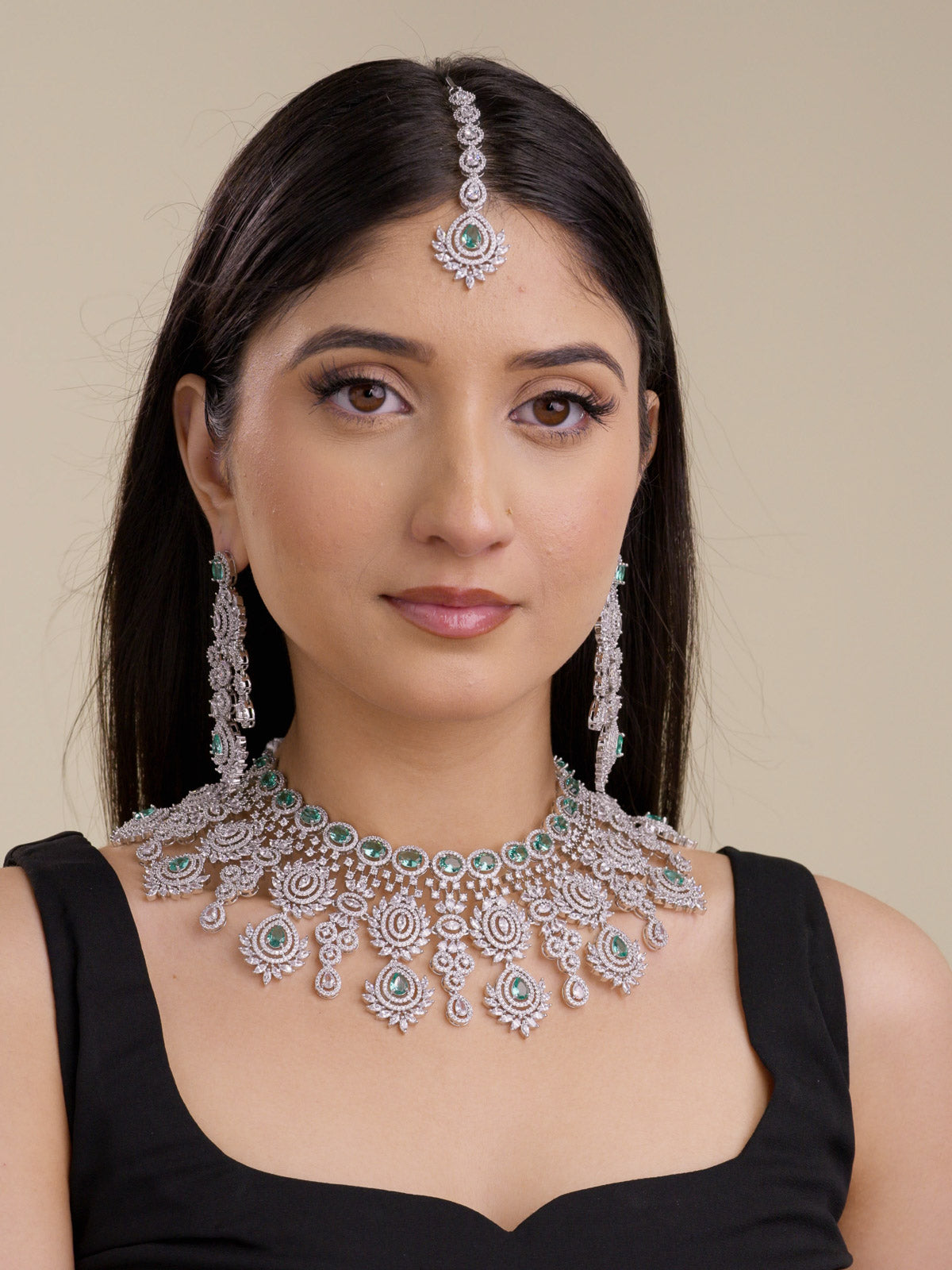 American Diamond necklace set in silver tone with soft mint-green stones, shown on a model with matching long earrings and maang tikka in a full front bridal-style view.