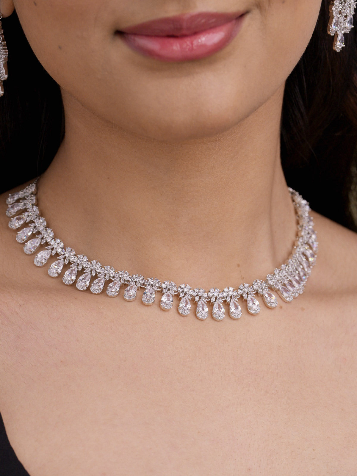 American Diamond neutral variant necklace set in silver tone with clear CZ teardrop fringe on model close-up