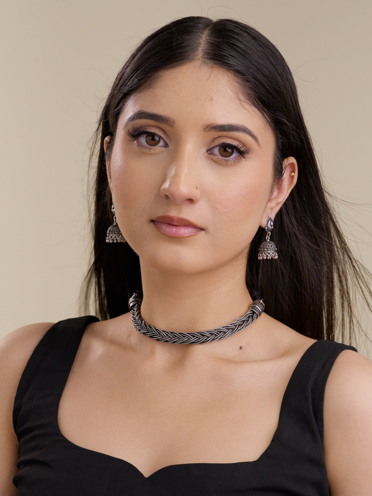 Oxidised braided choker necklace set with matching jhumka earrings shown in a full model view.